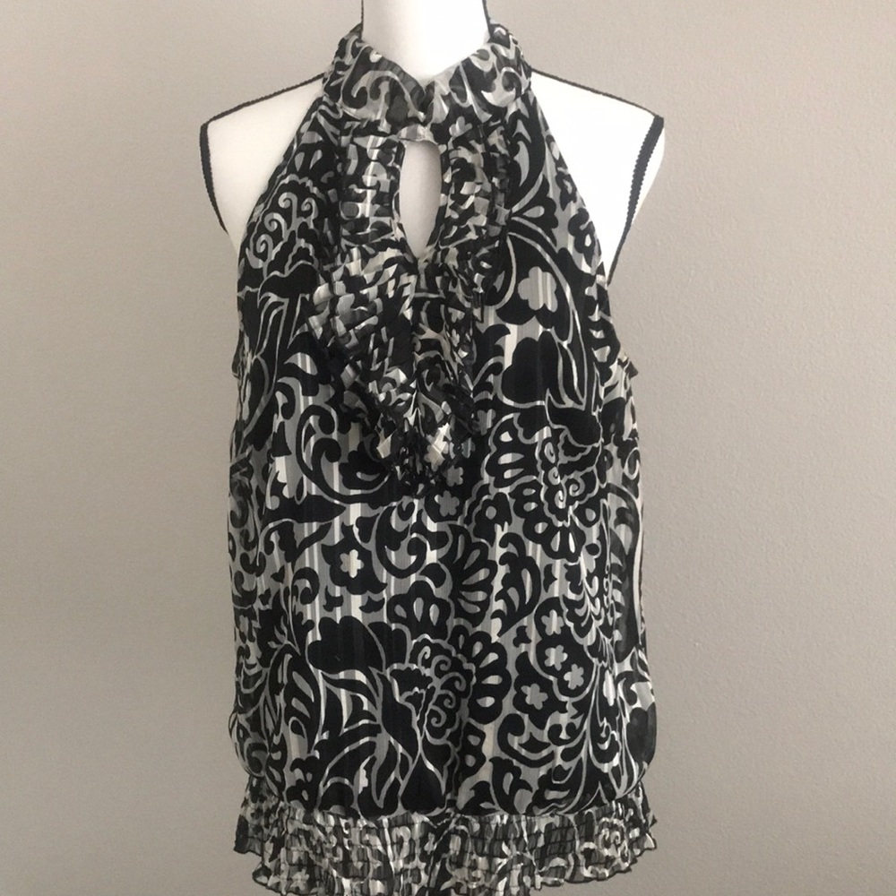 3/$10 or $4. Sleeveless Blouse